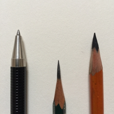 Pens and pencils side by side