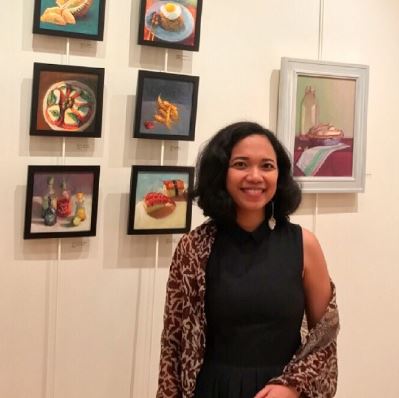 Photo of Dian in front of her work